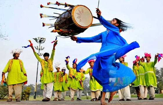 A poet reciting poetry to an engaged audience.