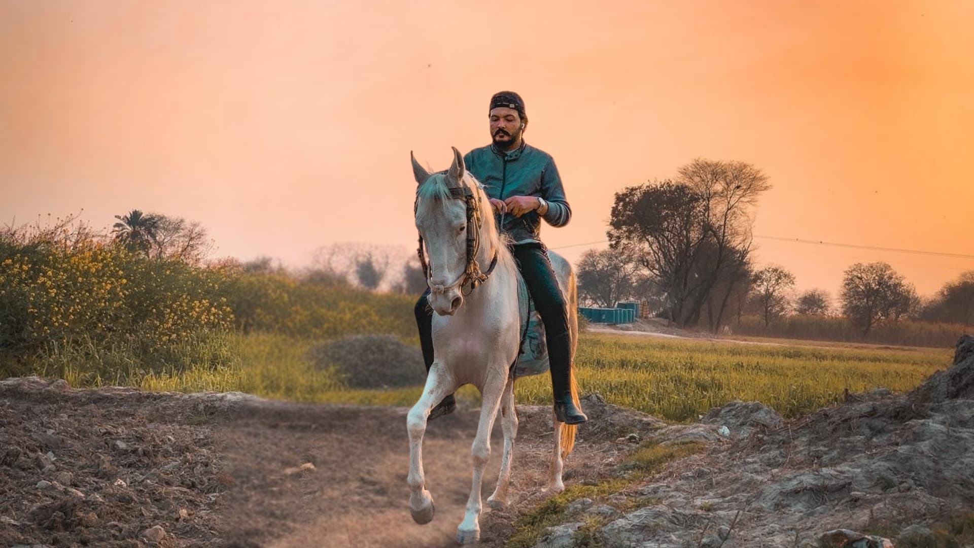 Syed Nawazish Mohi Ud Din on a majestic horse, embodying the equestrian spirit of Punjab.